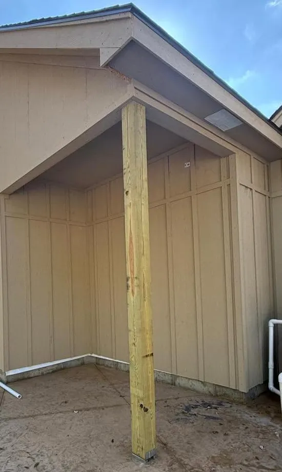 New engineered wood siding and covered corner installed on a Kansas City home